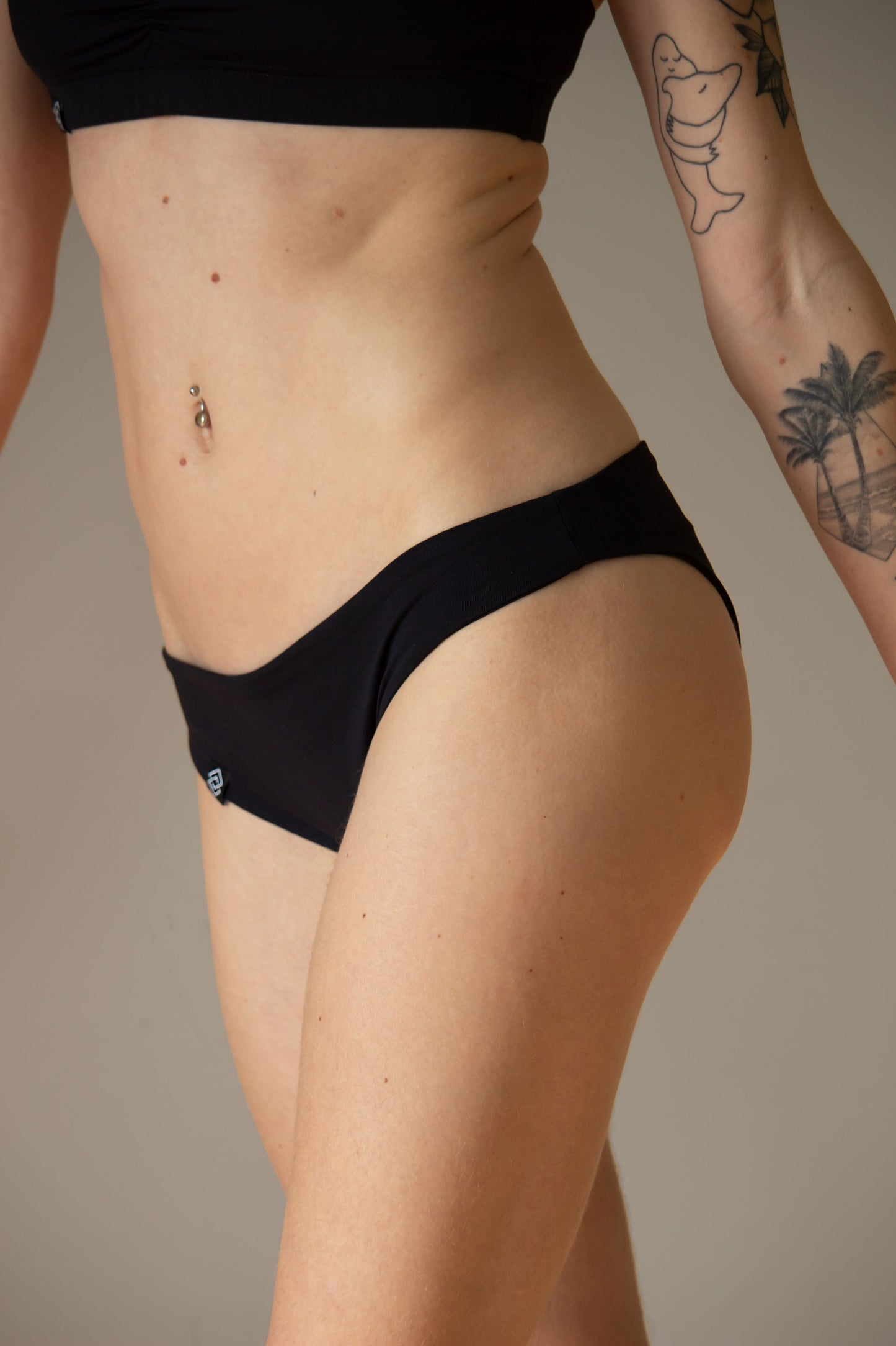Low waist black micro shorts for pole dance with a cheeky brazil scrunch back
